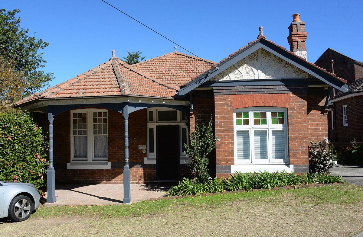 A red-brick Federation cottage in Lindfield with a gabled roof and small front garden